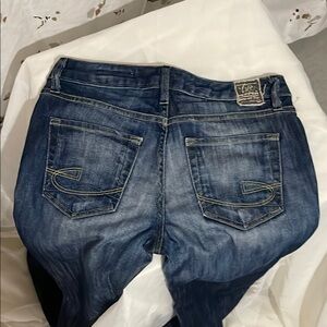 Chip & Pepper Blue Boot Cut Jeans with Distressing and Faded Wash.